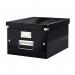 The photograph captures a sleek black Leitz Click & Store collapsible storage box from ACCO Brands. Its medium size makes it perfect for storing A4 documents. The box features a unique click system for easy assembly and sturdy storage.