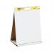 A group of Post-it flipchart pads displayed on a Super Sticky Table Top Easel Pad, with a 3M Dry Erase Board nearby. The bright colors and large writing space make it perfect for brainstorming sessions or presentations.