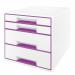 On a white and purple background stands a stylish and functional Leitz WOW CUBE Drawer Cabinet, featuring four drawers - two large and two small - perfect for storing A4 Maxi documents. The sleek design adds a touch of modernity to any workspace.