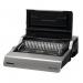 This picture shows a sleek, electric comb binding machine from Fellowes. It has a silver and black design, with a clear display screen and various buttons and dials. The machine is compact and appears to be high-quality.