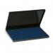 In the photograph, a blue Trodat Stamp Pad in size large (158x90mm) is prominently displayed. The pad is rectangular in shape with rounded corners. The surface is smooth and evenly colored, appearing to be well-saturated with ink. The edges are clean and crisp, and the Trodat logo is visible in the bottom corner. Overall, the stamp pad appears to be high-quality and suitable for professional use.
