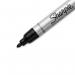 The picture features a pack of 12 Sharpie Pro Metal Barrel Permanent Markers with a bullet tip of 1.0mm and a sleek black design. The markers are arranged neatly with the Newell Brands logo displayed prominently on the packaging.