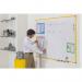 A bright and modern magnetic whiteboard, featuring a yellow aluminum frame and ultra-bright lacquered steel surface. Perfect for meetings, classrooms, or home office use. Measures 900x600mm in size and easily mounts on any wall.