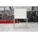 The image shows a silver Bi-Silque magnetic whiteboard on a Bi-Office desk. The whiteboard is made of magnetic lacquered steel and measures 1200x900mm. It has a sleek and professional appearance, perfect for any modern office setting.