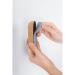 The photograph captures a sleek, modern whiteboard eraser with a magnetic design. The eraser is made of cork material, giving it an eco-friendly touch. The clean lines and minimalist design make it a perfect addition to any office or educational setting. Its compact size ensures easy handling and efficient erasing.