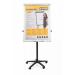The photograph shows two Bi-Silque flipchart easels, both with mobile capabilities. The classic design features a magnetic surface measuring 700x1000mm in a cool grey color. The easels are set up in a meeting or presentation setting, with sheets of paper attached to the easel for easy note-taking and visual aids. The clean and professional look of the easels make them suitable for use in a variety of settings.