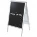 The photo features two sleek black chalkboards with the brands logo on the corner. Each board has a smooth surface and a sturdy easel backing, perfect for writing and displaying notes or messages. The elegant design and high-quality materials make it a functional and stylish addition to any space.