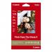 The image of Canon Photo Paper PP-201 shows a pack of 20 sheets in a glossy finish, measuring 13 x 18cm. The packaging features the Canon logo and product name on a white background. The paper appears smooth and high-quality, perfect for printing vibrant and professional-looking photos.