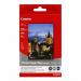 The photograph captures a stack of glossy photo paper, each sheet measuring 10x15cm. The semi glossy finish adds dimension to the images, making them pop with vibrancy. The stack contains 50 sheets, perfect for all your printing needs.