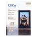 The photograph showcases a stack of 30 sheets of glossy photo paper from Epson, specifically designed for printing beautiful photos. The paper measures 13 x 18cm and has a high-quality, professional finish. The vibrant colors and sharp details captured on this photo paper are sure to impress.