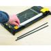 This picture shows a set of Fellowes Trimmer Accessories, specifically the A3 Cutting Strips model 19986J. The cutting strips are rectangular, made of durable material, and designed to fit perfectly on the Fellowes trimmer for precise and smooth cuts.