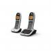 This photograph features a pair of sleek British Telecom cordless telephones. The phones have large buttons and a modern design. They also include an answer machine and use DECT technology.