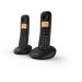 This photograph shows two British Telecom cordless telephones, model BT Everyday Twin Dect, featuring a sleek black design with a clear digital display and call blocker function. The phones are sitting on a matching base and come with a set of instructions.