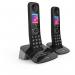 This photo features a pair of sleek and modern British Telecom cordless telephones in black. The telephones are equipped with a call blocker function and an answer machine, making them a convenient and efficient choice for communication. The sleek design and advanced features make these telephones a great addition to any home or office setup.